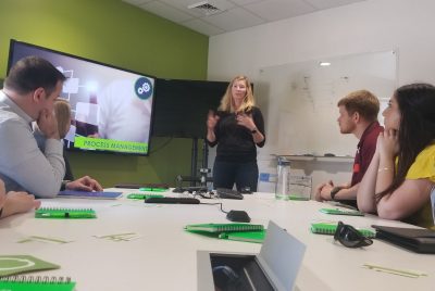 Amy Ankrum, president and CEO of Qualtrax, discusses the core values of her company, in a presentation to  a group that included the Executive MBA students and two Virginia Tech faculty members.